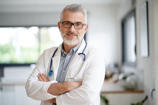 A doctor with arms crossed in a clinic